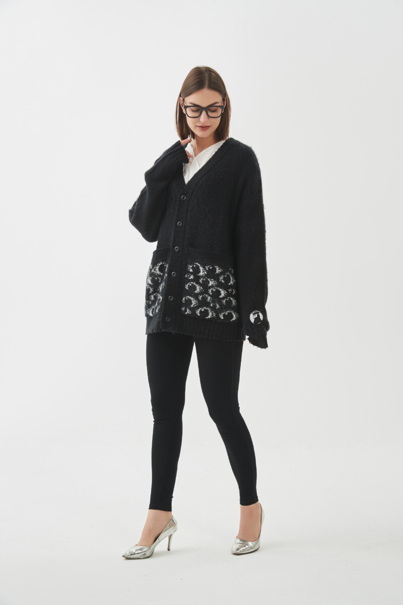 https://www.littlegoodknits.com/wp-content/uploads/2023/11/Cute-Designer-City-Urban-Chic-Simple-Modern-Street-Style-Stylish-Relaxed-black-and-white-knitted-top-sweater-mohair-jumper-cozy-comfy.jpg